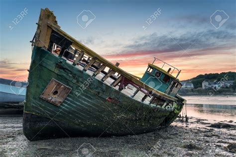 An Old Wrecked Wooden Boat On The Shore Boat Abandoned Ships