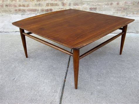 Modern cocktail tables support all the activities your family enjoys, giving your loved ones ample space to store magazines, remotes, drinks, and electronic devices. circa midcentury: 'bassett' walnut coffee table