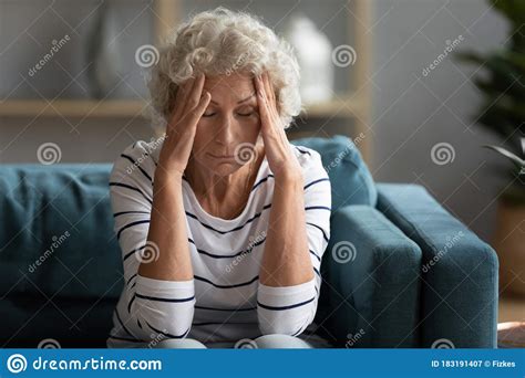 Unhappy Older Mature Granny Suffering From Headache Stock Image