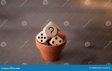 Game Dice With Question Mark In The Plant Pot On Wooden Background
