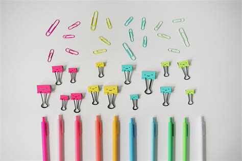 Colorful Office Supplies Arranged In Rainbow On White Table Photograph