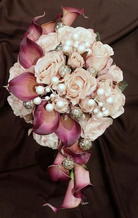 Beautiful Fushia Calla Lilies With Pale Pink Roses Accented With Some