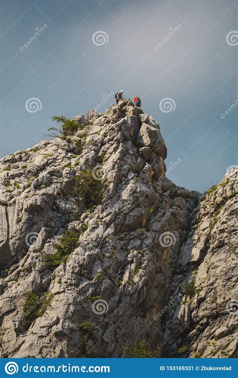 Two Climbers Climb To The Top Of The Mountain Stock Image Image Of