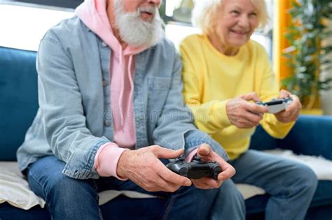 Excited Man And Woman Playing Video Game Console Mature People Playing