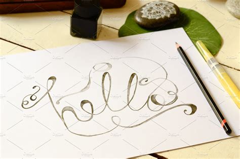 The Word Hello In Calligraphy High Quality Education Stock Photos