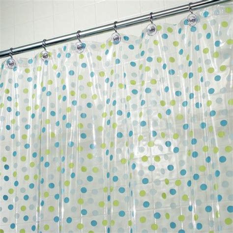A Shower Curtain With Blue And Green Polka Dots