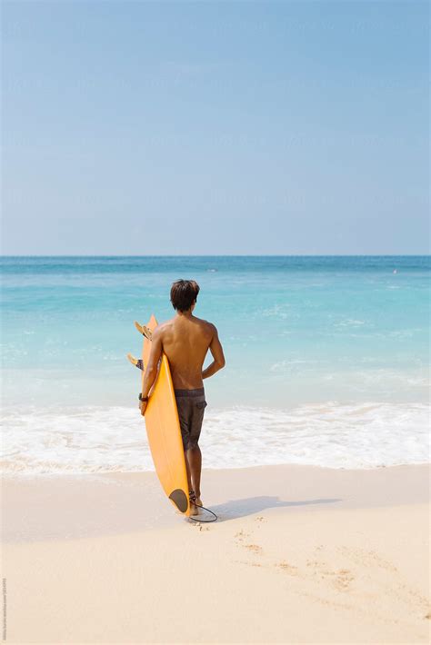 Man At The Beach With Surfboard By Brandon Tabiolo Printscapes