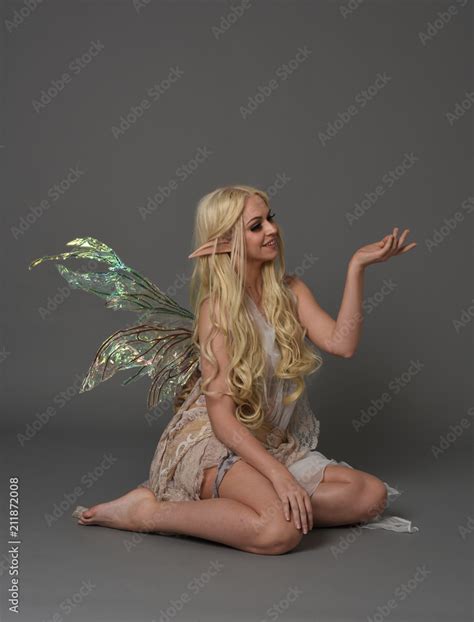 Full Length Portrait A Blonde Girl Wearing Fairy Costume Seated Pose