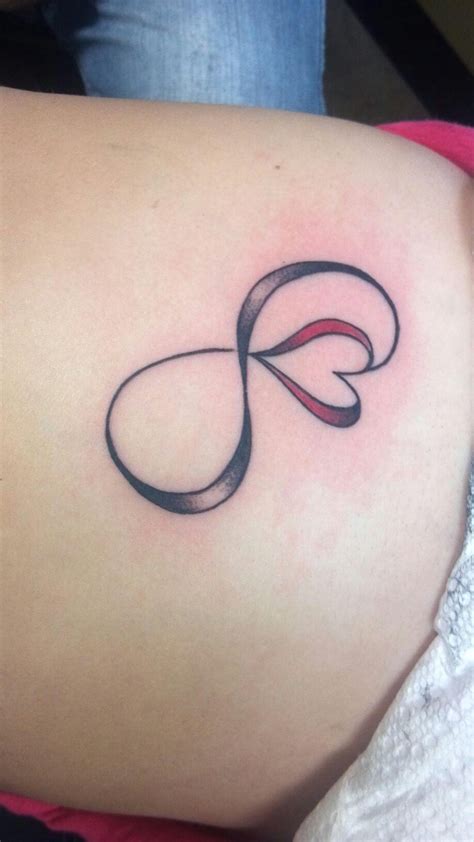 Black tattoos are mostly used with a name under them, flowers, cross or even angel wings. Infinity Tattoo With Heart - CreativeFan