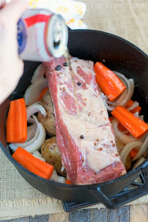 Add 1 cup of water and the bottle of guinness. Dutch Oven Corned Beef and Cabbage · The Typical Mom