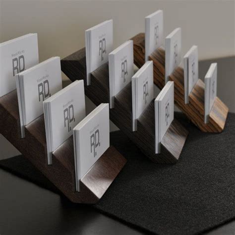 The claimed multiple business card holder is used for displaying a plurality of sets of business cards within one body. Multiple Business Card Holder/ Tier Business Card by ...