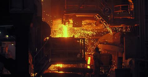 Hard Work In A Foundry Metal Smelting Furnace In Steel Mill Molten