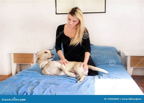 Woman With Her Dog In Bed At Home Relaxing In Bedroom Beautiful Girl