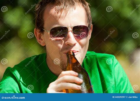 Man Drinking Beer From Bottle Stock Image Image Of Garden Nature