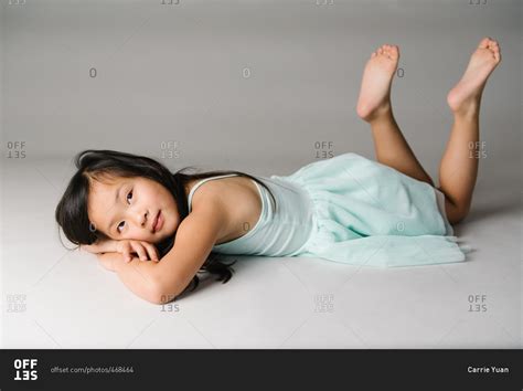 Young Girl Lying Down With His Hands In His Face Hoodoo Wallpaper