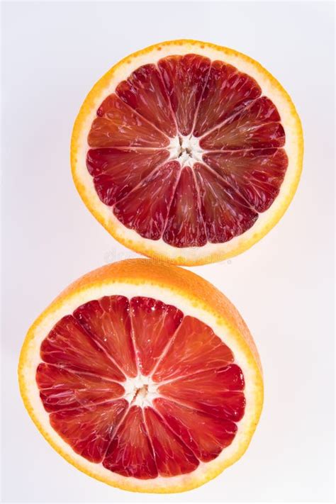 2 Halves Of A Cut Blood Orange Isolated On White Stock Image Image Of