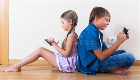 Children Playing In Mobile Phones Stock Photo Image Of Little