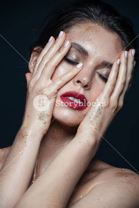 Beauty Portrait Of Tender Young Woman With Glitter Makeup Touching Her