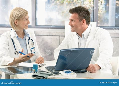 Two Medical Doctors Consulting Stock Photo Image Of Collaboration