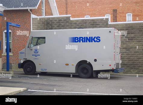 An armoured brinks truck delivering money to an ATM Stock Photo - Alamy