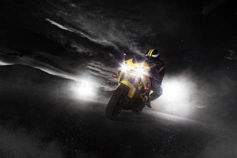 Supersport Motorcycle Driver At Night With Smoke Around Stock Photo
