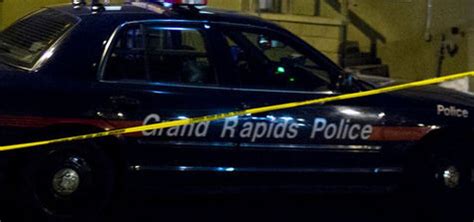 grand rapids police cruiser stolen as officer helps assault victim