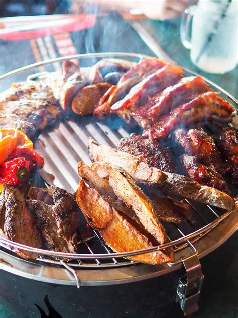 It has a rugged, cast stone base with a charming decorative center ring, which elevates its overall this one has a sizable grill surface for burgers and dogs, and a deep base to get the fire roaring for hanging out after dinner. Burgers and Mega Milkshakes at Smokey Bones | Tasty Chomps ...