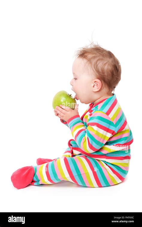 Baby Girl Eating Apple Isolated On White Stock Photo Alamy