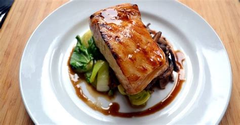 This seared chilean sea bass recipe is made with a filet served atop wilted sesame spinach and drizzled with a spicy, sour. Brown Sugar Glazed Chilean Sea Bass | Recipe | Brown sugar glaze, Chilean sea bass, Sea bass