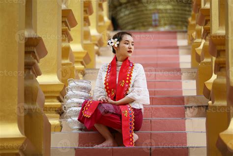 Young Asian Girl In Traditional Burmese Costume Holding Bowl Of Rice On