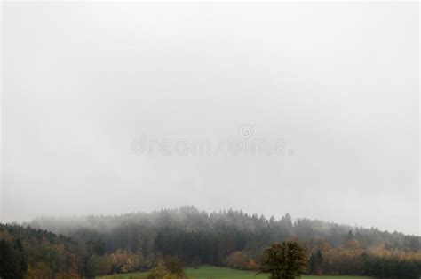 Landscape with Visible Horizon on a Foggy November Day with Indian Fall