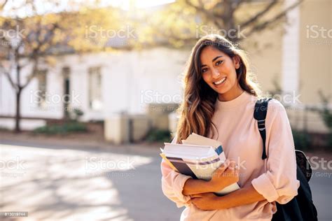 Female College Student With Books Outdoors Stock Photo