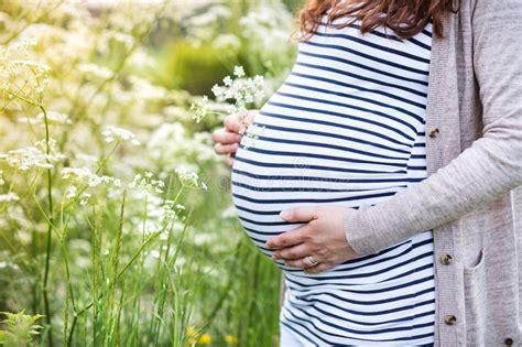 Unrecognizable Pregnant Women Holding Her Belly Summer Nature Stock
