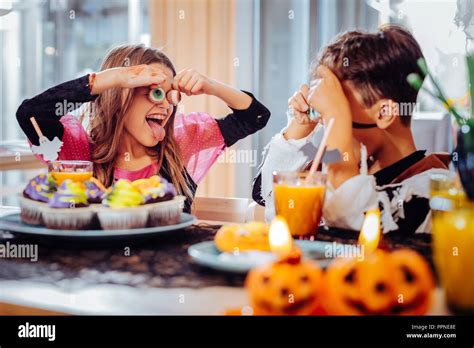 Cute Funny Brother And Sister Playing Tricks While Having Halloween