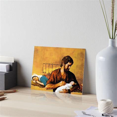 St Joseph Holds Baby Jesus While Mary Sleeps Art Board Print For