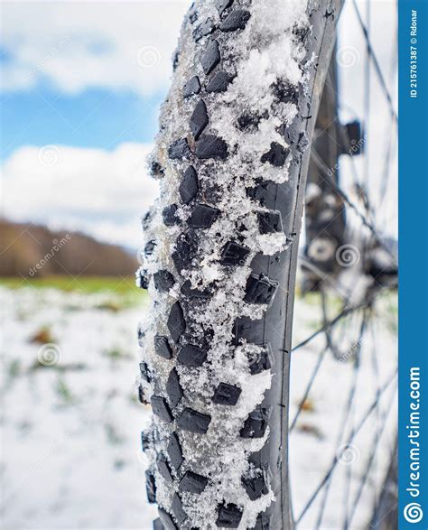 Detail Of A Mountain Bike Tire Tread Filled With Snow On A Snowy