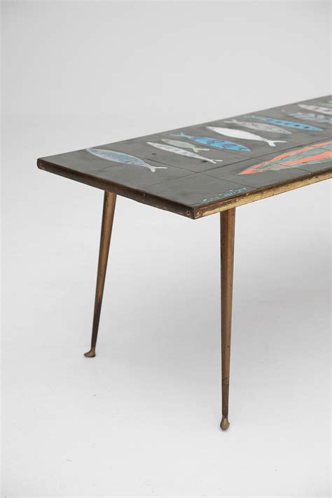 Coffee tables, consoles, cabinets & more coffee & end tables entertainment & media sets cabinets & credenzas bookcases, shelves & piers City Furniture | CERAMIC FISH COFFEE TABLE