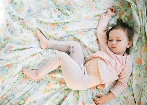 Cute Babe Girl Asleep On Bed Stock Photo OFFSET
