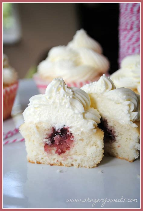 Almond Wedding Cake Cupcakes with Raspberry Filling - Shugary Sweets