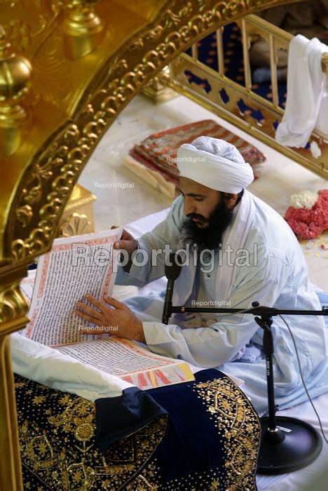 Reportage Photo Of Sikh Holy Man Reading From The Guru Granth Sahib