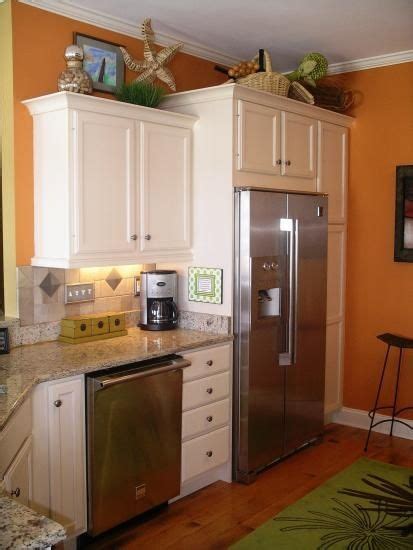 You will have to do some repairs on the wall, but then you're ready for something new. Cabinets over the fridge and skinny ones between appliances | Home kitchens, Luxury kitchen ...