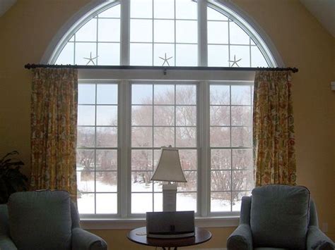 Windows curtains are one of the main ingredients for any indoor decorations. A Stroll Thru Life: Where To Hang Drapes Over An Arched Window