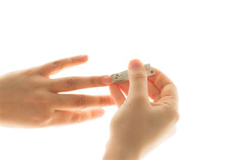 Woman Cutting Nails Using Nail Clipper Stock Photo Download Image Now