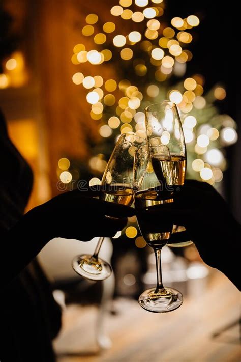People Celebrating Christmas With Glasses Of Champagne In Their Hands For A Toast Stock Image