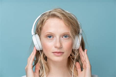 Closeup Portrait Of Young Woman Closed Eyes Listening Music Via