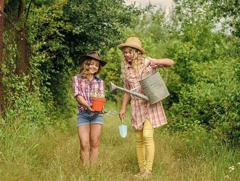 Girls In Hats Planting Plants Rustic Children Nature Background