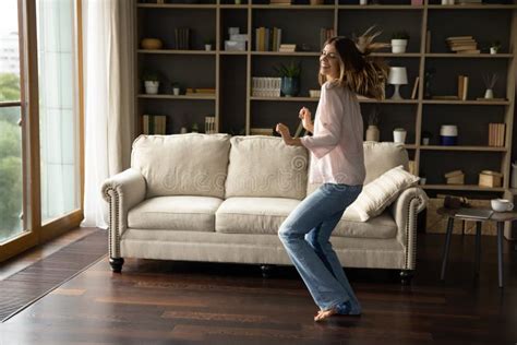 Lively Woman Dancing In Modern Living Room At Home Stock Image Image