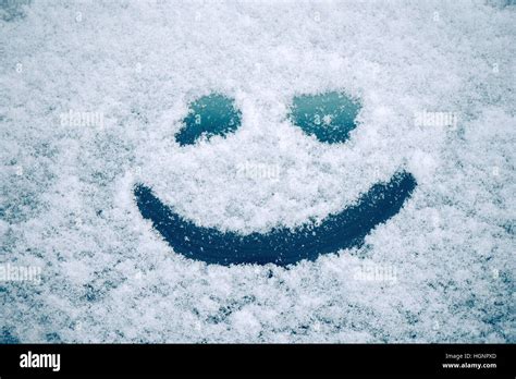 Happy Smiley Emoticon Face In Snow Winter Season Joy And Happiness