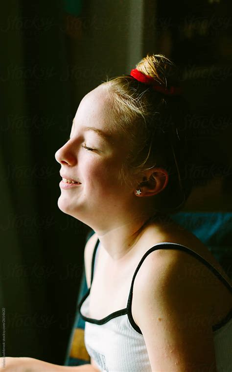 Smiling Preteen Girl With Eyes Closed By Helen Rushbrook