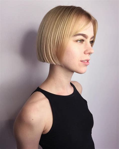 This Short Blonde Blunt Bob With Parted Bangs Is A Great Modern